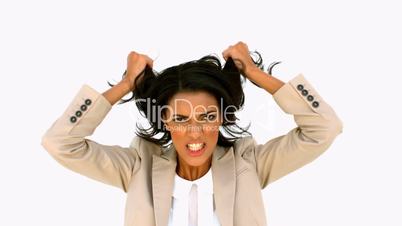 Stressed businesswoman shaking her hair