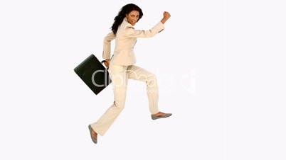 Businesswoman jumping with her suitcase