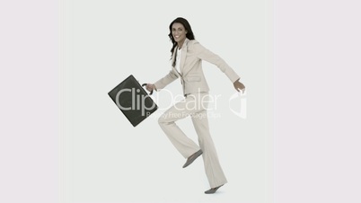 Businesswoman jumping in the air with her suitcase in black and white