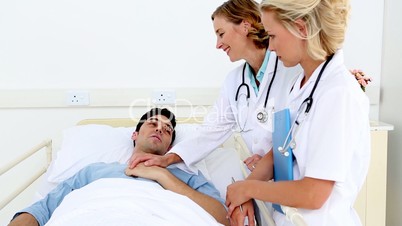 Doctors taking care of a patient