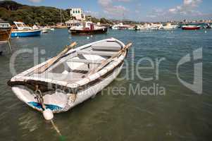 Beautiful small boat anchored in the port