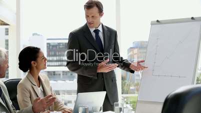 Confident businessman giving presentation