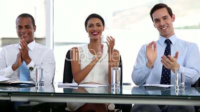 Business people applauding in office
