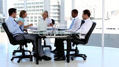 Business team talking around a desk