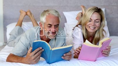 Couple reading books in the bedroom 