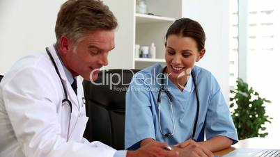 Doctors talking together in their office