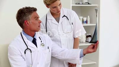 Doctors examining x-ray