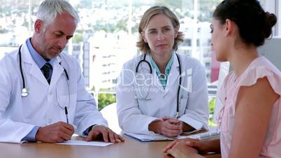 Doctors speaking with patient