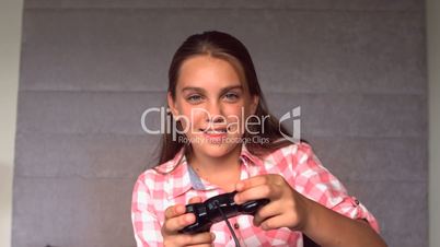 Girl playing at video game