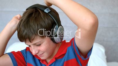 Young boy enjoying music with headphones