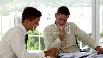 Businessmen going over the plans