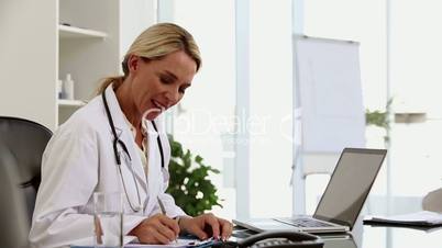 Busy doctor working at her desk