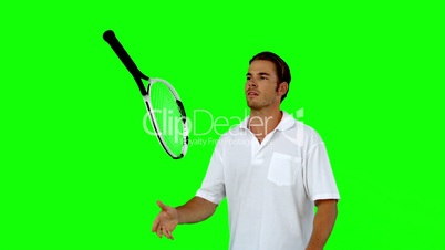 Tennis player throwing his racket