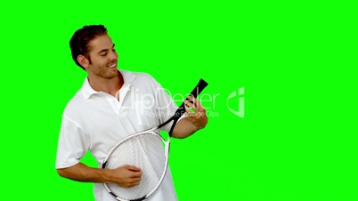 Tennis player using his racket as guitar