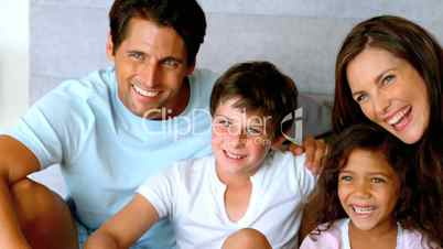 Family spending time together in a bed