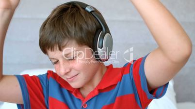 Young boy enjoying music with headphones