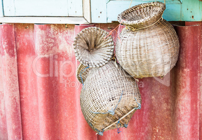 Handmade wicker baskets for fish hanging on wall