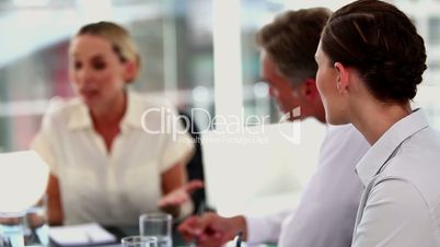 Angry businesswoman shouting at colleagues