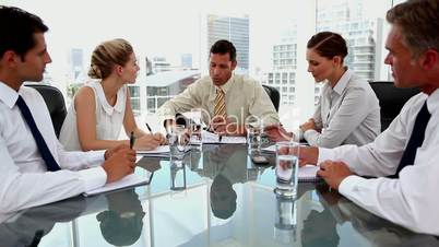 Businessman talking to colleagues