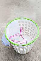 Cloth hanger and wash bag in plastic laundry basket