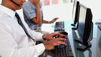 Business people typing on keyboard