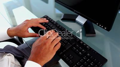 Close up of hands typing 