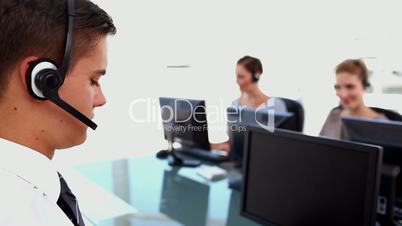 Confident business people working in a call centre