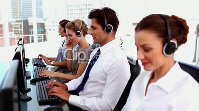 Smiling call centre agents with headset