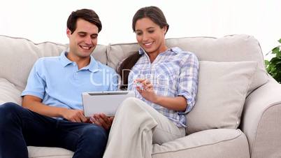 Young couple using tablet