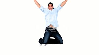 Young man jumping on white background