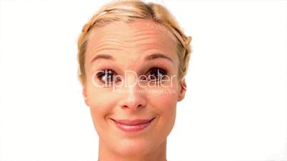Woman smiling and looking at the camera on white background