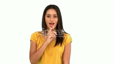 Woman asking for silence on white background