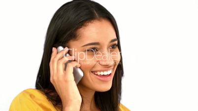 Woman talking on the phone on white background 