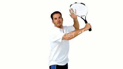 Handsome man playing tennis 