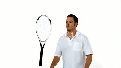 Tennis player throwing his racket