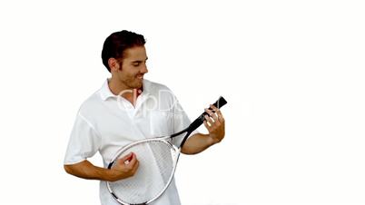 Tennis player using his racket as guitar