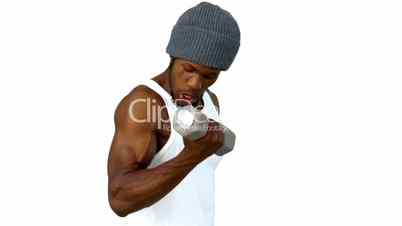 Young man using dumbbell