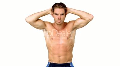 Shirtless man flexing muscles