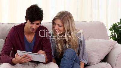 Couple using tablet together