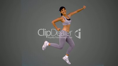 Attractive brunette jumping and posing