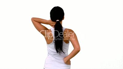 Fit woman stretching her neck and back