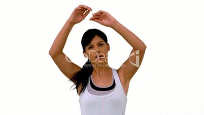 Fit woman stretching out her arms