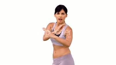 Fit woman striking a karate pose