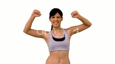 Fit woman tensing her arm muscles
