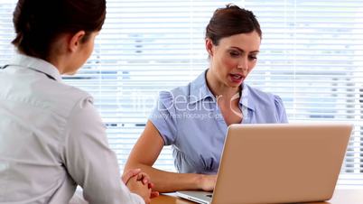 Colleagues chatting in the office