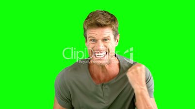 Man showing his happiness on green screen