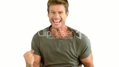 Attractive man gesturing and showing his happiness on white background