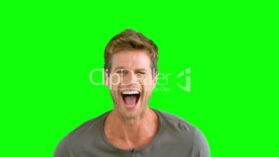 Man laughing on green screen