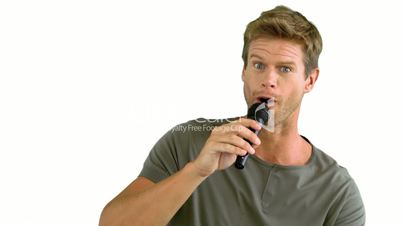 Man with microphone singing on white background
