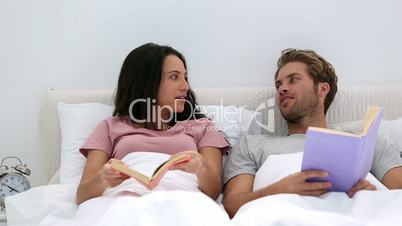 Couple talking about the books they are reading